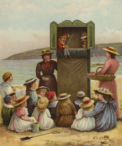 ビーチでパンチとジュディのショーを見ている子供 作： English School